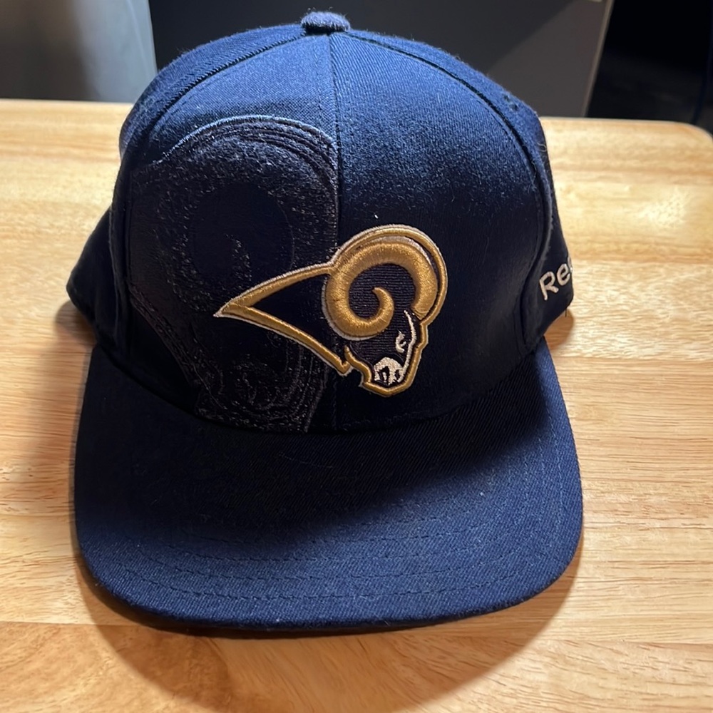 Navy blue St. Louis Rams fitted hat, never worn.